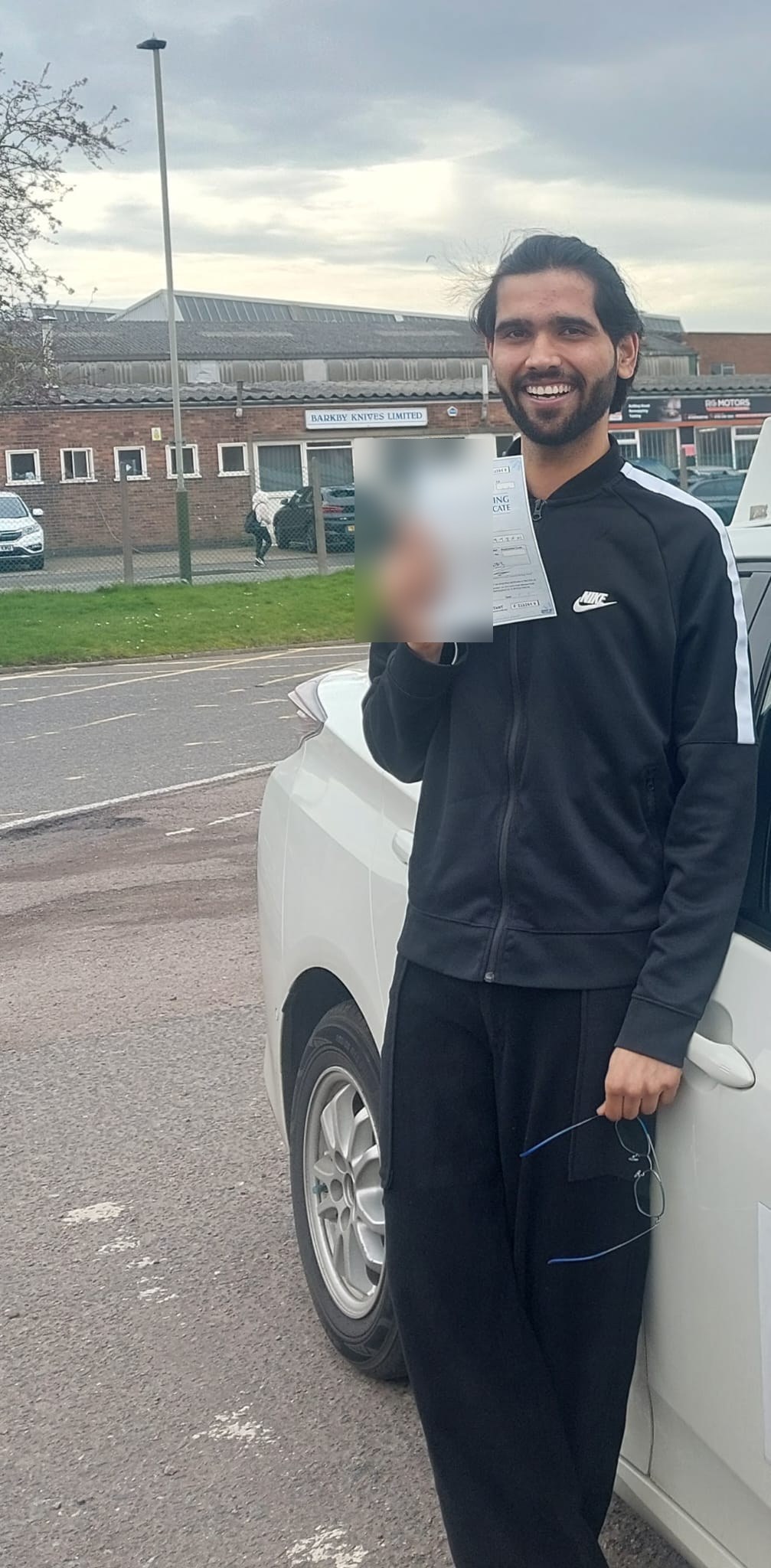 Learner celebrating a driving test pass